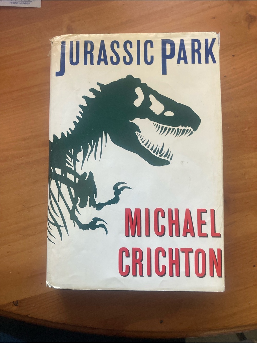 Jurassic Park by Michael Crichton - White Hard Cover with Green Dinosaur
